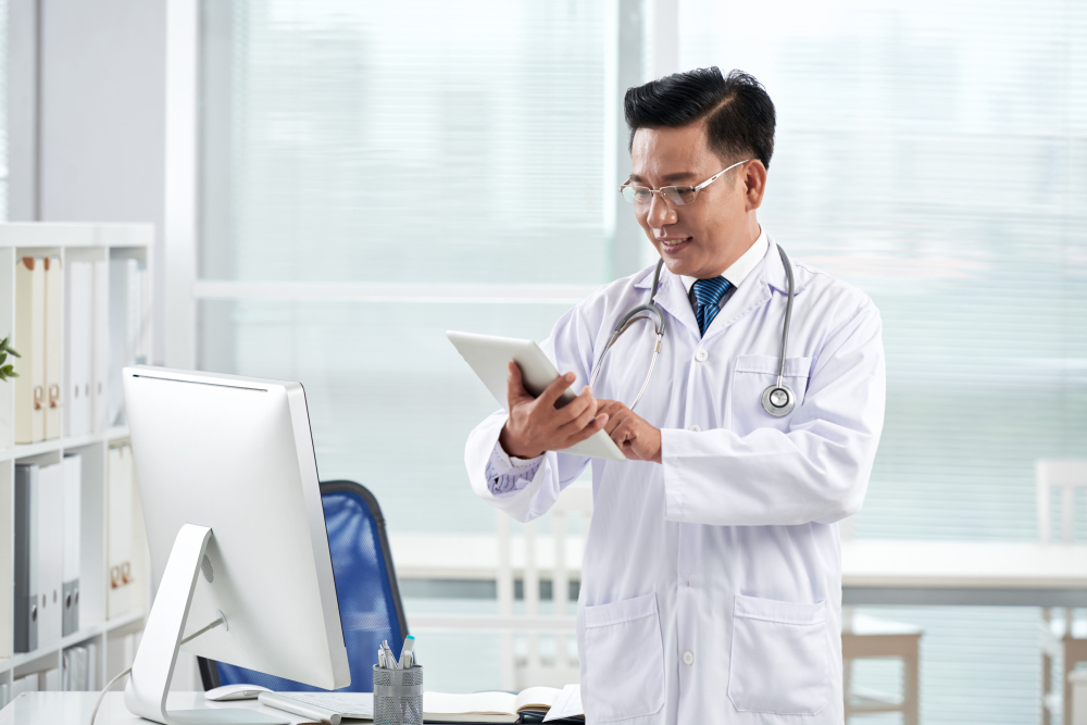 asian-doctor-using-medical-app-his-digital-device