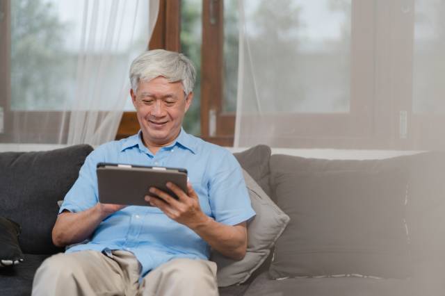 asian-senior-men-using-tablet-home-asian-senior-chinese-male-search-information-about-how-good-health-internet-while-lying-sofa-living-room-home-concept (1)