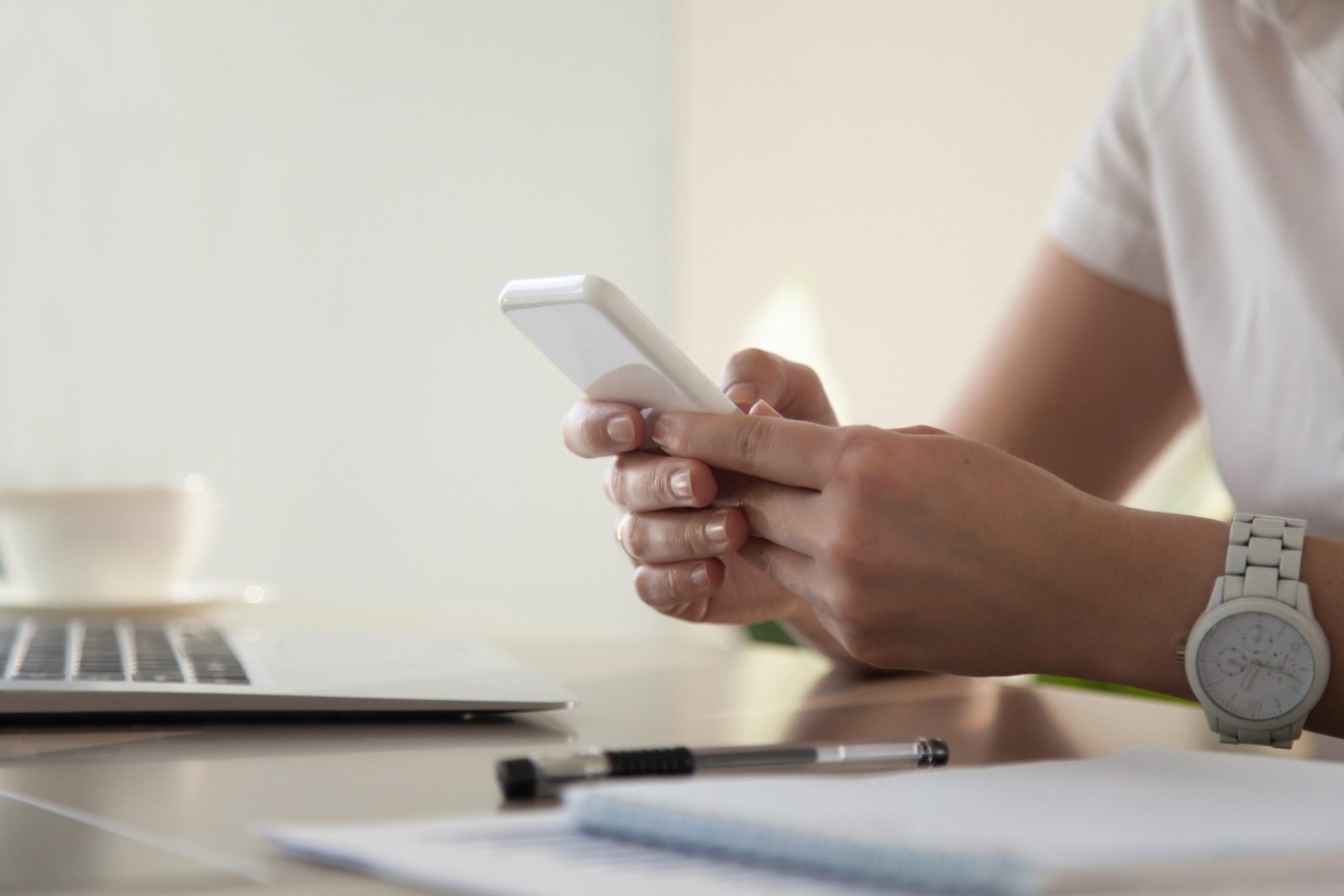 businesswoman-looking-important-contact-phone (1) (1) (1) (1)