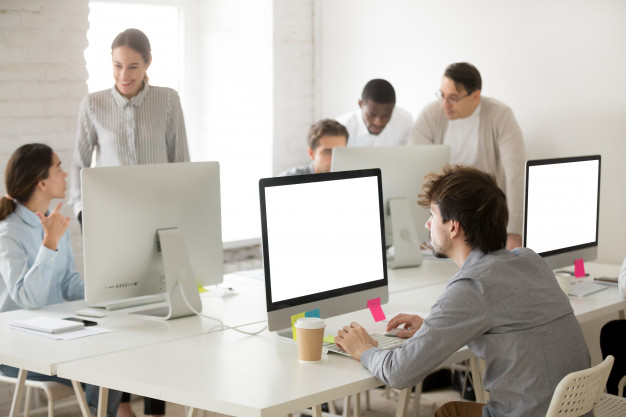 diverse-corporate-employees-group-working-together-using-computers-office_1163-5124