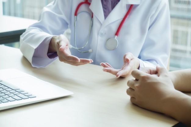 doctor-patient-are-discussing-something-just-hands-table_1421-51