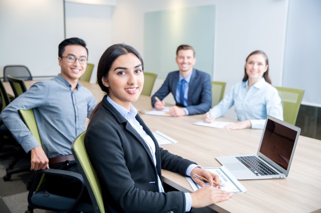 smiling-business-lady-working-with-colleagues_1262-2153