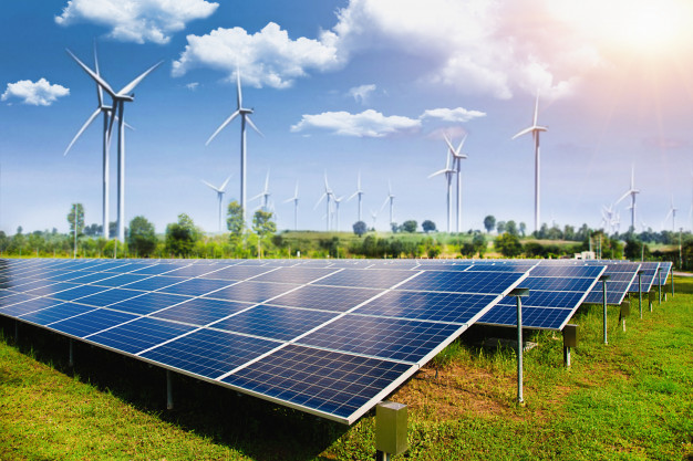 solar-panel-with-wind-turbines-against-mountains-sky_34237-198