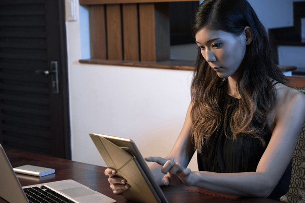 Woman working on tablet computer