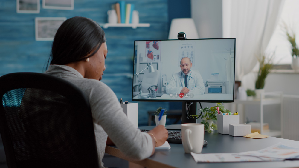 young-woman-writing-respiratory-sickness-treatment-notebook-discussing-pills-treatment-during-online-healthcare-videocall