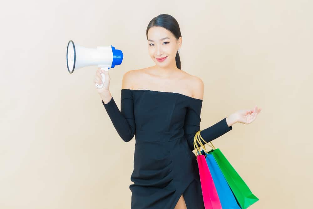 portrait-beautiful-young-asian-woman-smile-with-megaphone-yellow